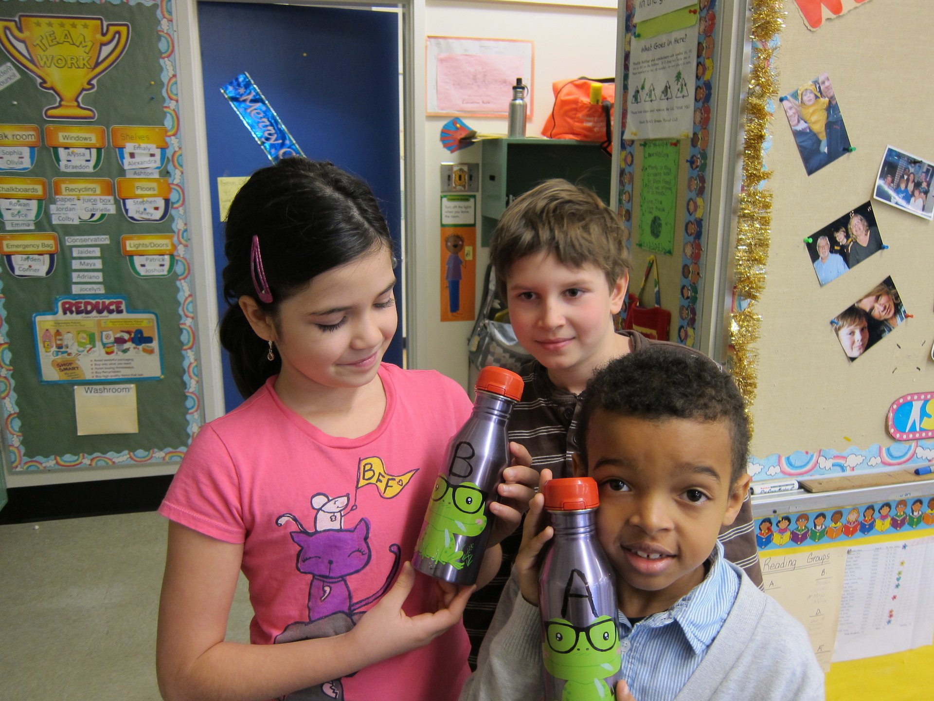 Grade 4 students proudly display their reusable water bottles.